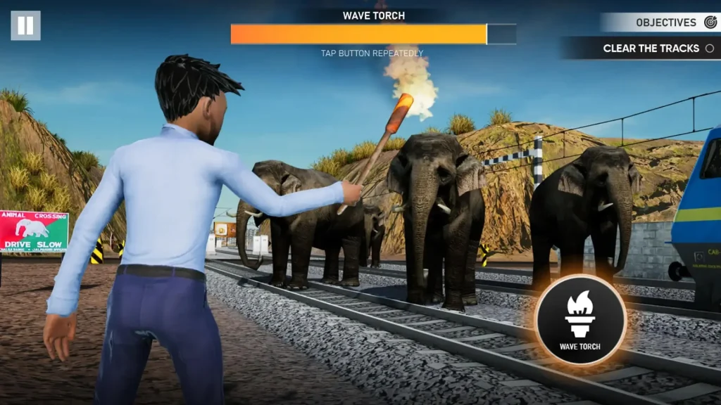 In Indian Train, a man is waving the torch to divert the elephants.